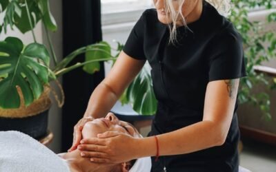 A soothing face massage session in a serene spa with natural light and plants.